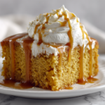 Pumpkin bars topped with cream cheese frosting, sliced into squares