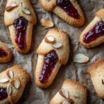 Halloween severed finger cookies with almond nails and oozing red jam