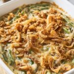 A classic Campbells Green Bean Casserole fresh out of the oven, topped with golden fried onions.