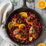 Golden cranberry orange chicken baked with fresh cranberries and citrus zest