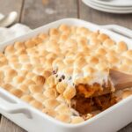 Sweet potato casserole with marshmallows in a ceramic baking dish