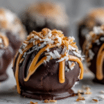 Samoa truffles with toasted coconut, caramel drizzle, and chocolate coating
