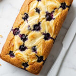 Blueberry cream cheese loaf with a rich cream cheese layer and fresh blueberries