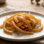 Candied orange peel recipe with glossy sugar-coated orange strips