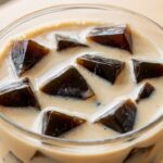 Easy vanilla maple protein iced coffee served over ice in a glass