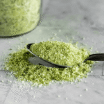 Jalapeño salt sprinkled over grilled corn on the cob