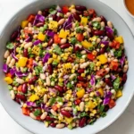 dense bean salad recipe with chickpeas kidney beans vegetables and creamy vinaigrette