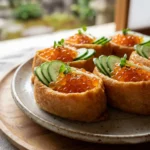 Open-top inari sushi topped with salmon roe and cucumber